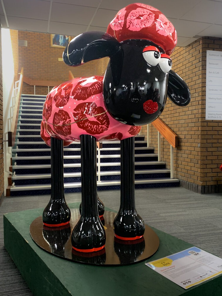 Image of the team at Plus Accounting in the reception area with a mini Shaun the Sheep sculpture